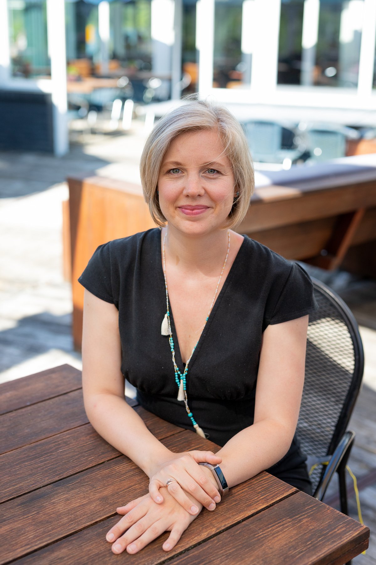 Claudia Kroon sitting at table looking straight at viewer
