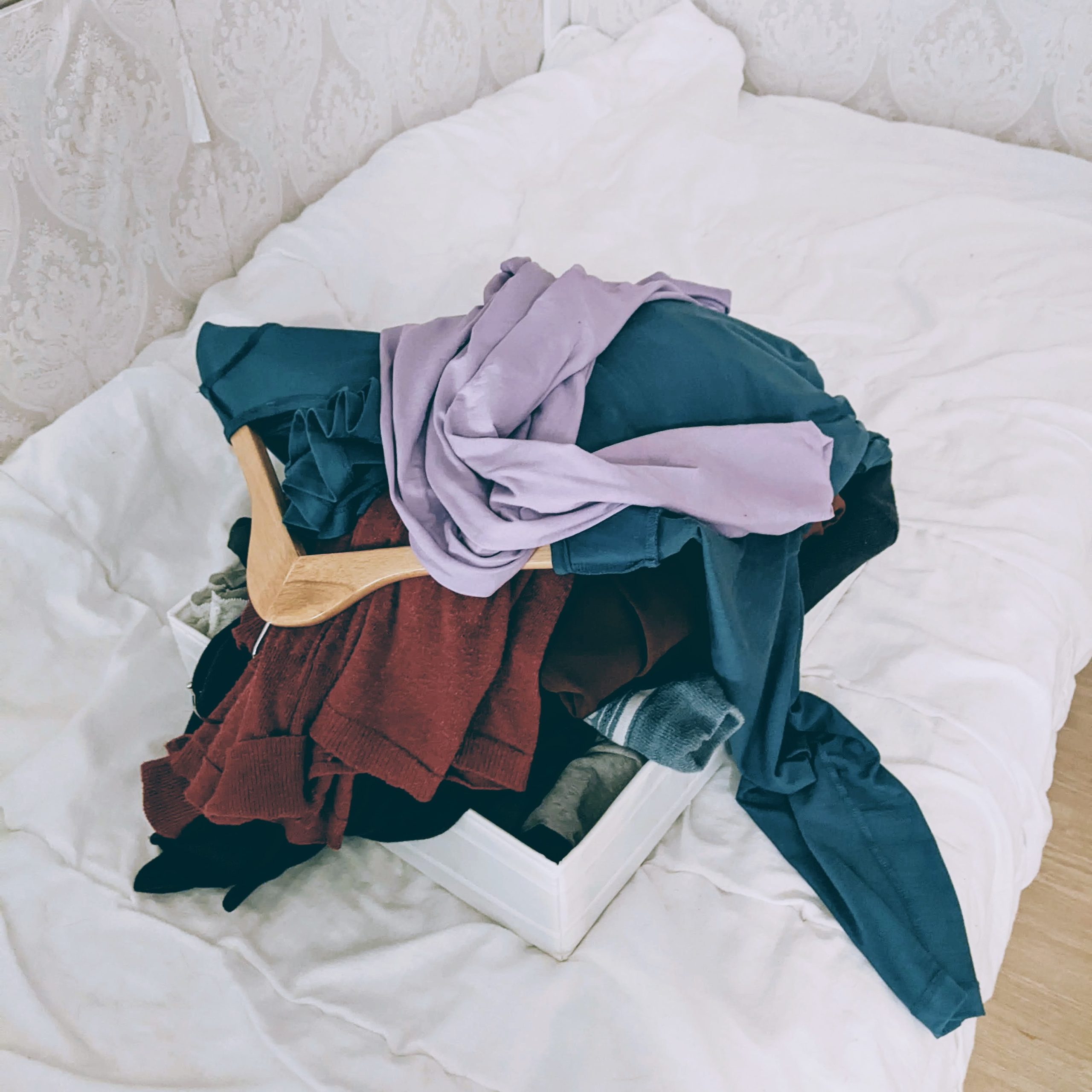 Pile of clothes on a bed
