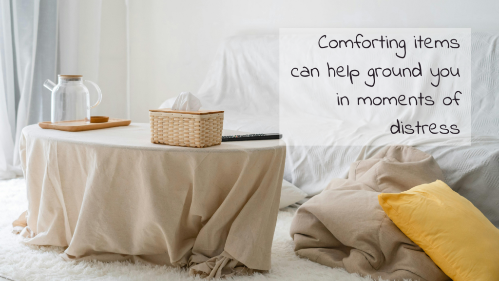 image of a cozy room with blankets, tissues and tea